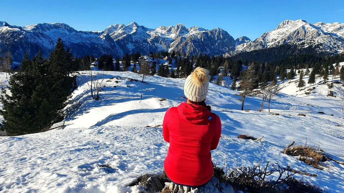 Romana Gorjanc by snow-covered mountains