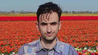 Vasilios Raptis standing in a field