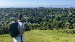 Barry Ryan overlooking Edinburgh from a hill
