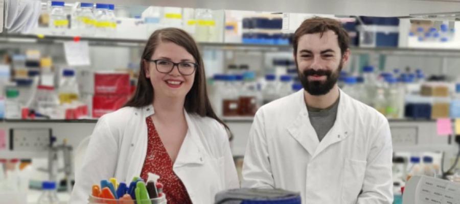 Two researchers standing in the lab