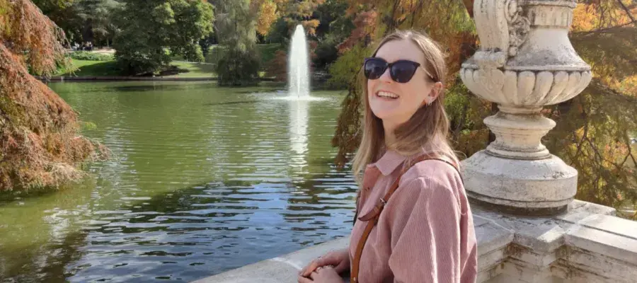 Kitty Sherwood by a fountain