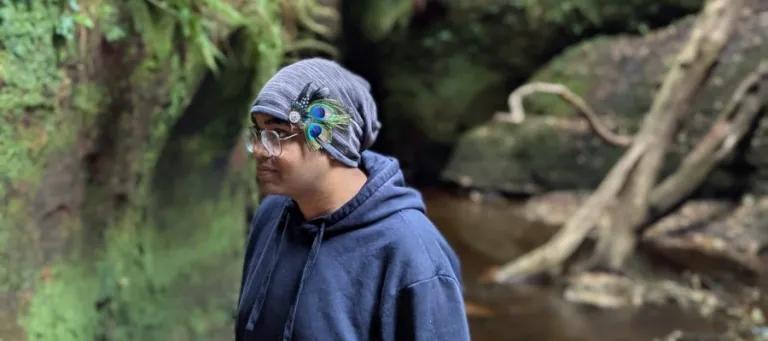 Tanmay Debnath in a valley by a river