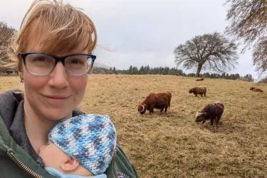 Lana with baby, by Highland cows