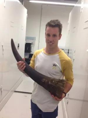 Kyle holding a rhino horn